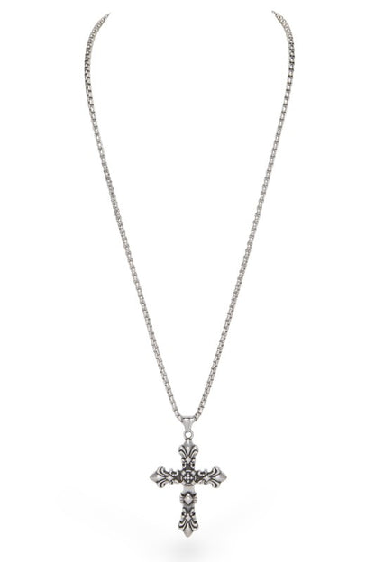 Metallic cross pendant necklace featuring ornate fleur-de-lis accents at each end and intricate central detailing with small cross motifs, vintage, gothic-inspired, and rich in symbolic craftsmanship.