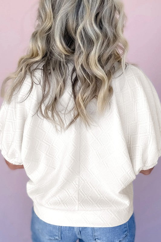 Designed with a zipper closure for easy wear and a sleek look.