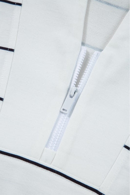 V-neckline with zipper detail adds a modern touch.