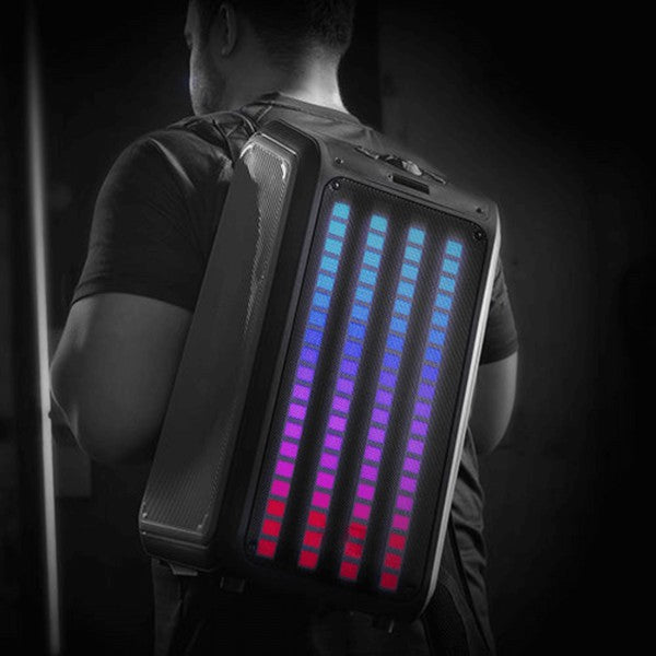 A tall portable speaker with colorful vertical LED lights, paired with a wired microphone and remote control—ideal for events, karaoke, or public speaking.