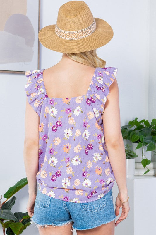 Airy, textured, and elegant — Swiss dot fabric enhanced with ruffle sleeves.