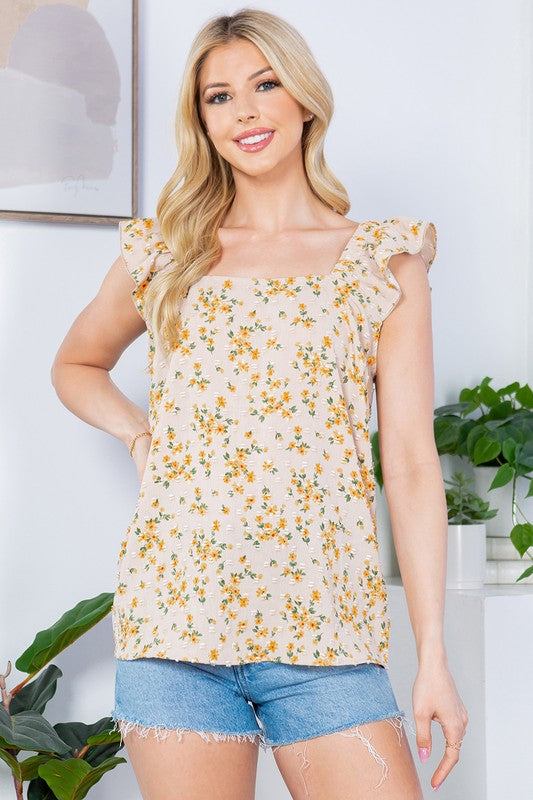 A flirty, textured top that marries Swiss-dot print with ruffle-sleeve detail.