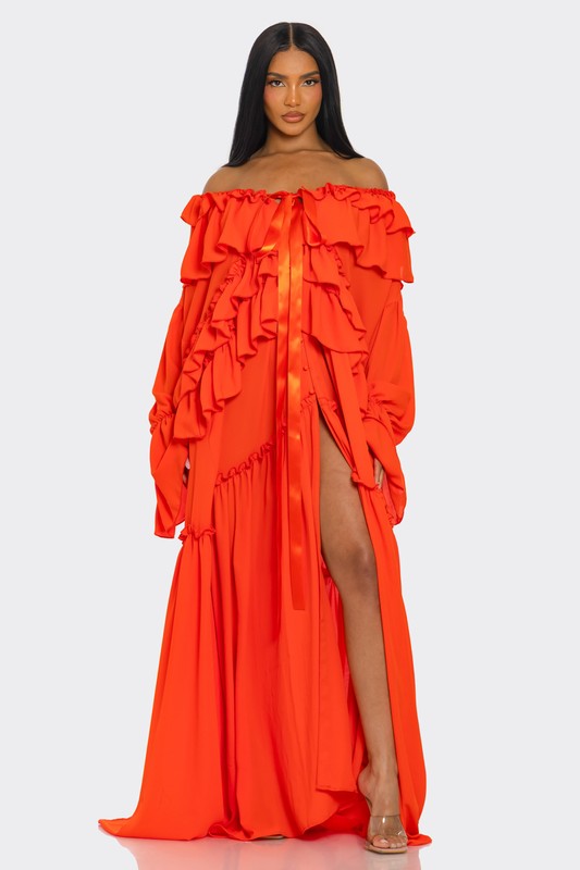 A vibrant off-the-shoulder gown in bright orange with dramatic ruffles cascading down the bodice and a high thigh-high slit on one side.
