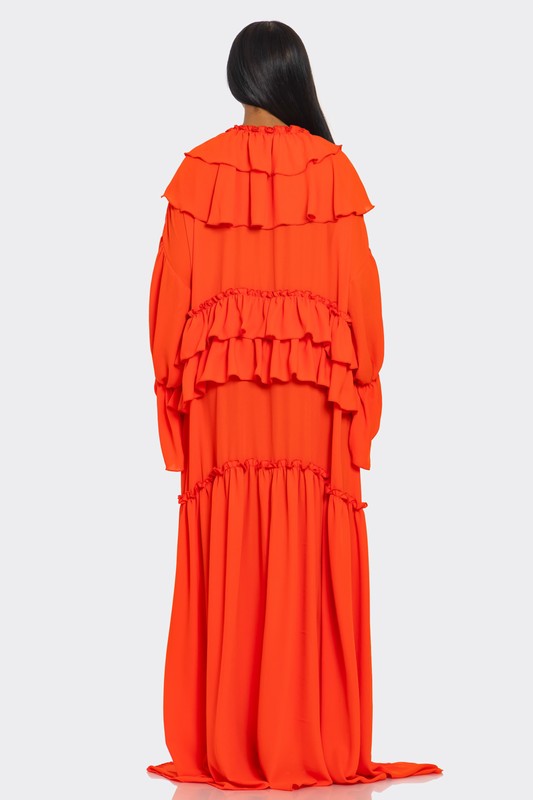 A vibrant off-the-shoulder gown in bright orange with dramatic ruffles cascading down the bodice and a high thigh-high slit on one side