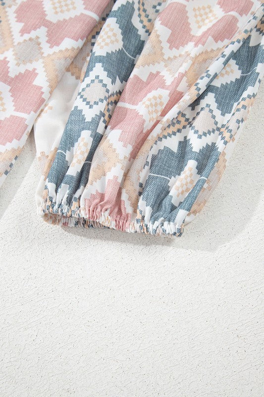 Dramatic balloon sleeves give a voluminous, whimsical silhouette. 