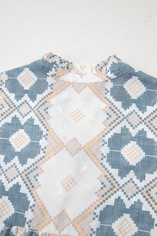 Split neckline with tassel tie offers adjustable styling and relaxed elegance. 