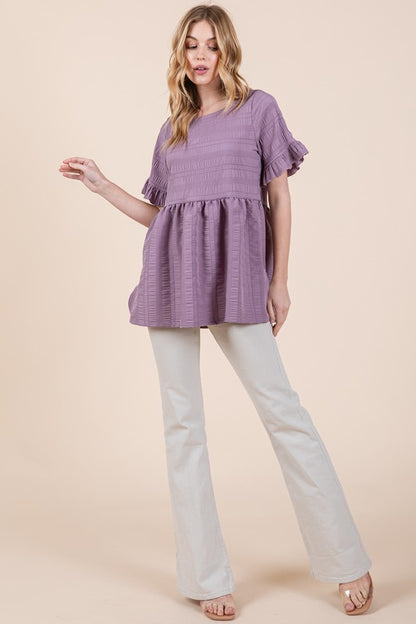 Casual yet chic, this tunic blends texture and flounce beautifully.