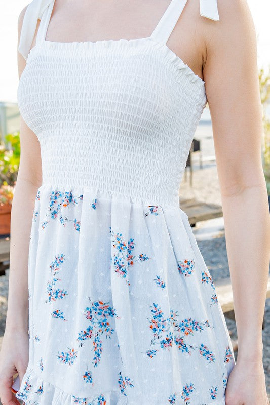 Smocked stretch meets feminine ties — a versatile top for day or night.