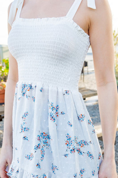 Smocked stretch meets feminine ties — a versatile top for day or night.