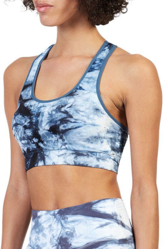 Made with breathable, moisture-wicking fabric and a scoop neckline, it’s the kind of bra you’ll want to wear long after your workout ends. The racerback design gives you full range of motion, while the soft band keeps everything comfortably in place.