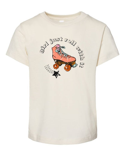 Beige t-shirt with a pink roller skate graphic and text on a white background