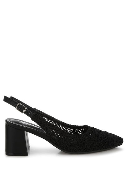 a stylish women's shoe with a closed, almond toe and an intricate lace-like upper in a light beige color.
