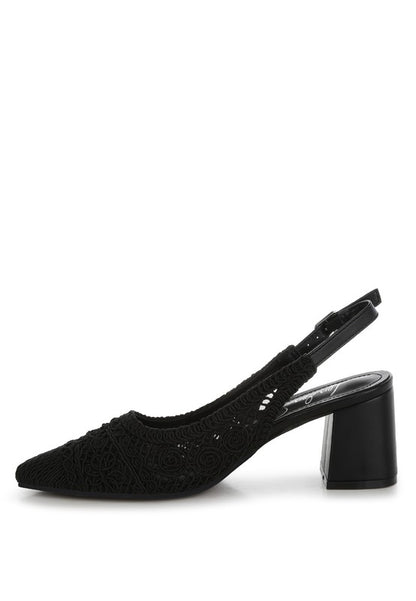 a stylish black women's shoe with a closed, almond toe and an intricate lace-like upper in a light beige color.