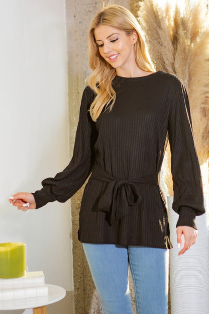 Breezy tunic designed with a flattering tie-waist accent for added charm.