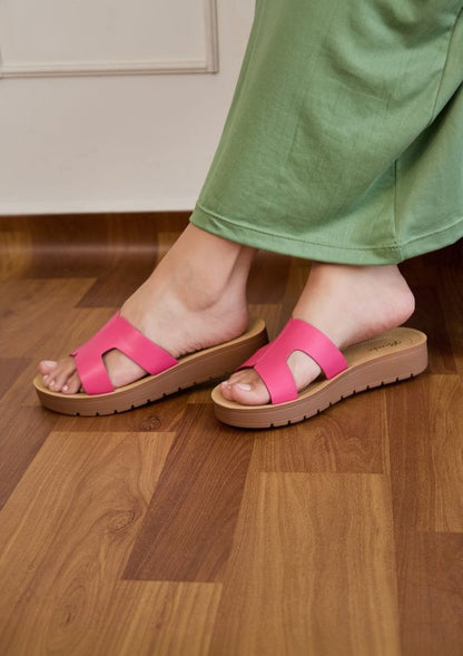 Flatform sandals featuring broad leather upper with side cutouts, open-toe silhouette, and thick textured platform sole