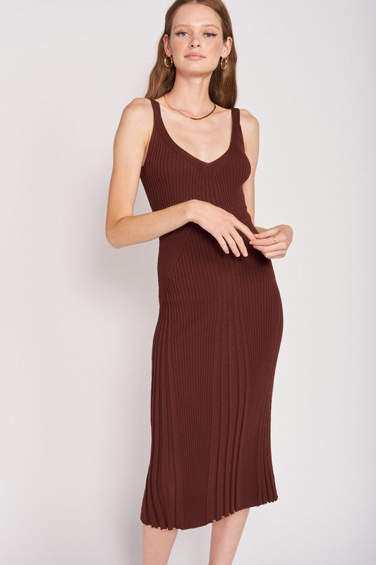 Woman wearing a brown ribbed dress 