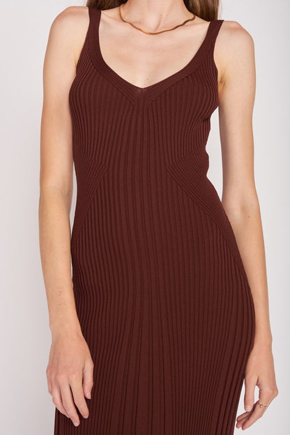 Brown ribbed dress worn by a person on a white background