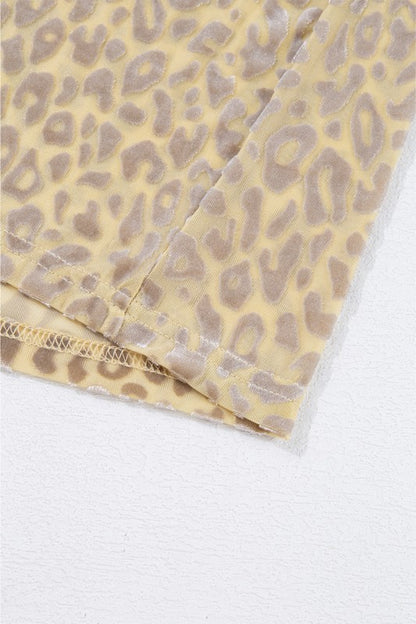 Long puff sleeves with elastic cuffs enhance the blouse's feminine silhouette.