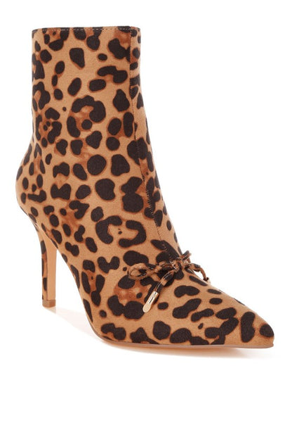Leopard print ankle boot with a pointed toe and high heel on a white background