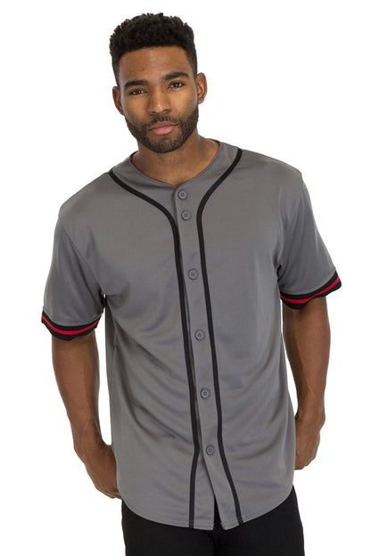 Man wearing a  baseball-style shirt with black piping, gray buttons, and red-striped short sleeves.
