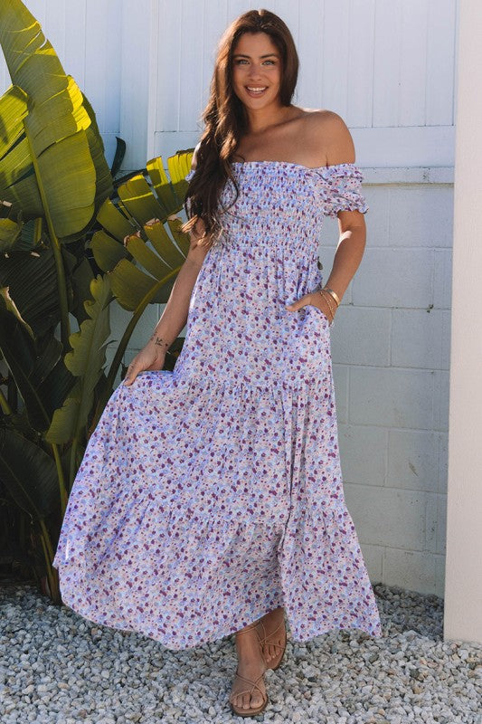 The bubble-sleeve shirred high-waist maxi dress combines voluminous, playful sleeves with a flattering gathered waist to create a flowy, elegant silhouette.