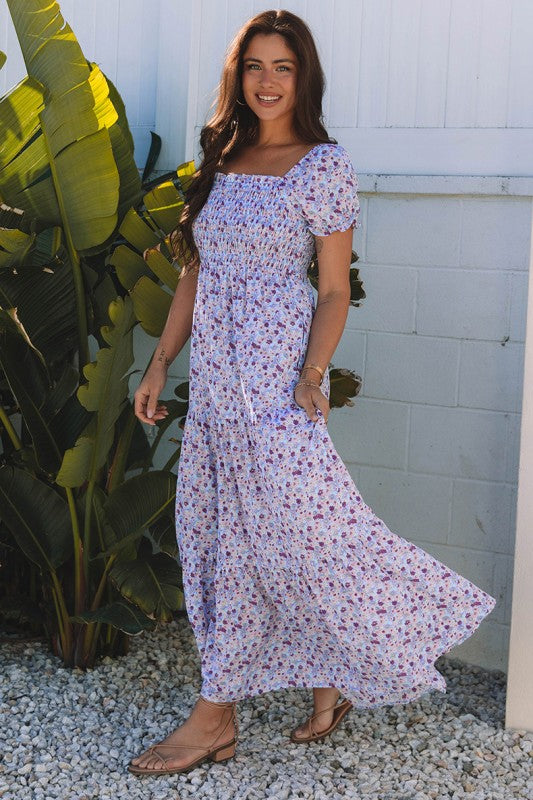 The bubble-sleeve shirred high-waist maxi dress combines voluminous, playful sleeves with a flattering gathered waist to create a flowy, elegant silhouette.