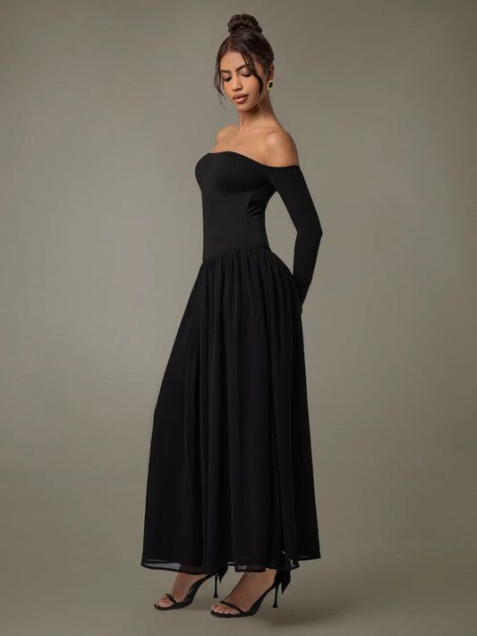 A floor-length black off-shoulder gown with a fitted bodice and voluminous skirt.