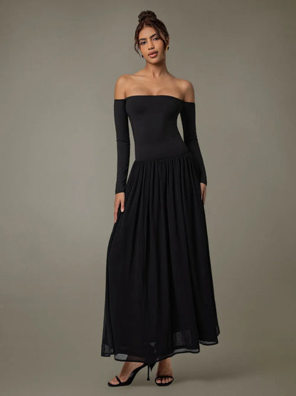 A floor-length black off-shoulder gown with a fitted bodice and voluminous skirt.