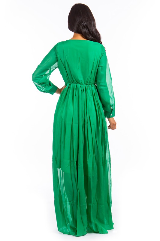This sexy maxi dress features a form-fitting silhouette, a daring plunge neckline, and a flowing floor-length skirt that elongates the figure while adding a sultry, glamorous vibe.