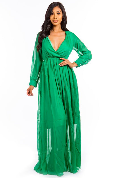 This sexy maxi dress features a form-fitting silhouette, a daring plunge neckline, and a flowing floor-length skirt that elongates the figure while adding a sultry, glamorous vibe.
