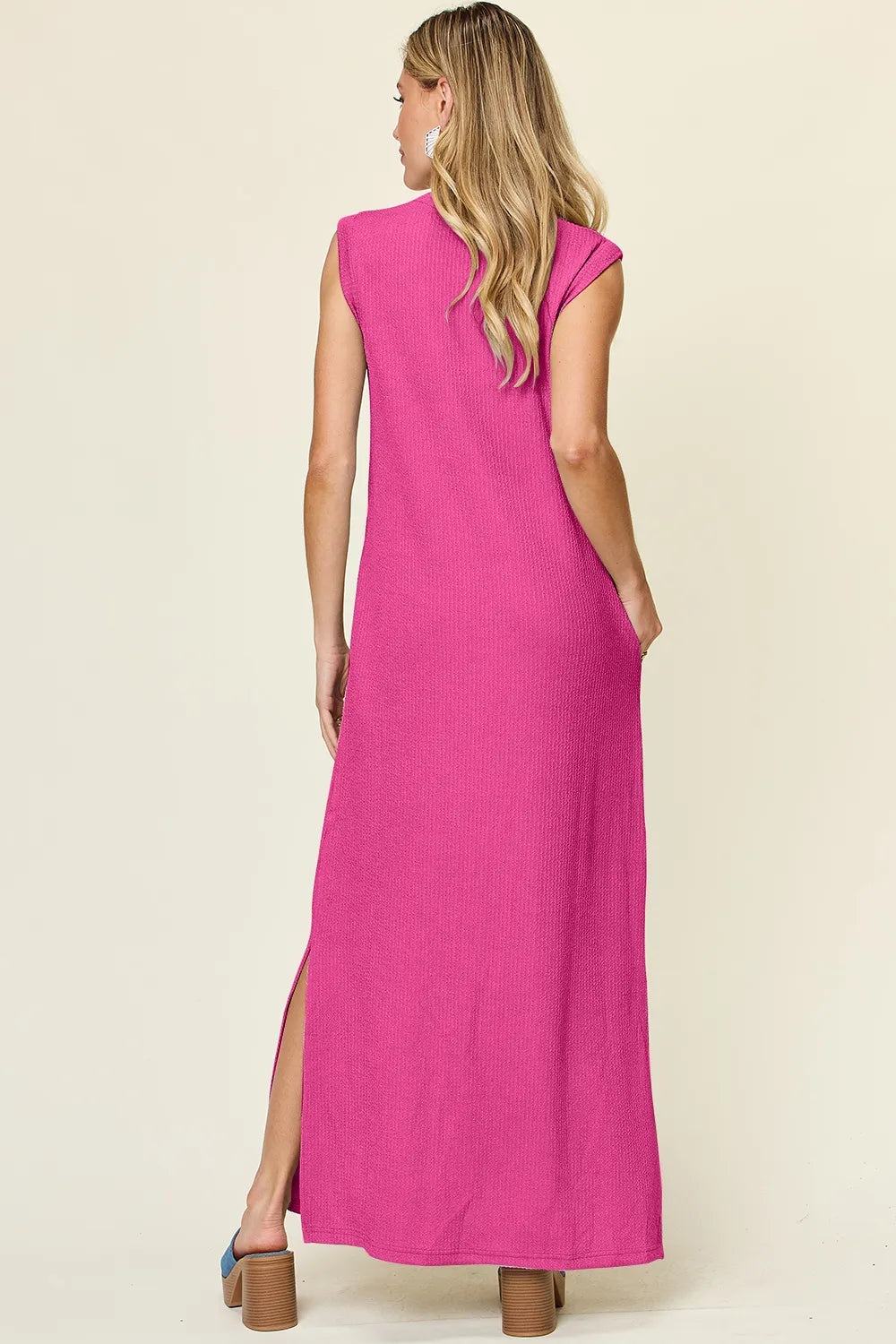 The Double Take full-size texture mock-neck sleeveless maxi dress features a sleek, textured fabric with a refined mock neckline and a flowing, floor-length silhouette for elegant, all-day wear.

