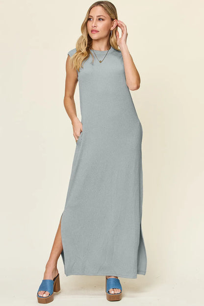 The Double Take full-size texture mock-neck sleeveless maxi dress features a sleek, textured fabric with a refined mock neckline and a flowing, floor-length silhouette for elegant, all-day wear.

