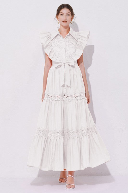A white, midi-length piece with a tiered, ruffled silhouette and short puff sleeves, featuring delicate lace detailing for a romantic, bohemian look.