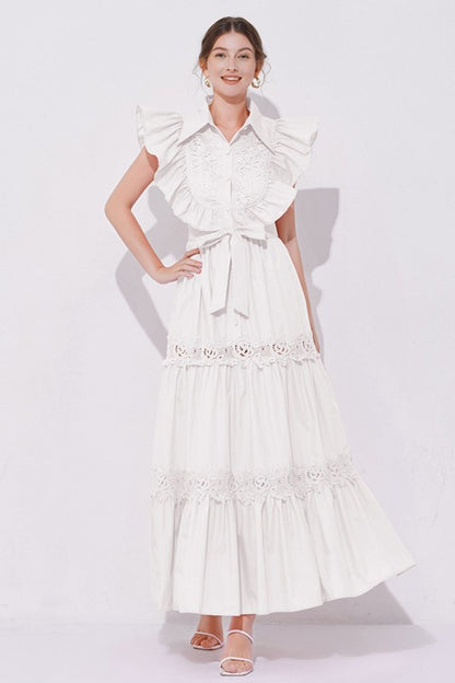 A white, midi-length piece with a tiered, ruffled silhouette and short puff sleeves, featuring delicate lace detailing for a romantic, bohemian look.