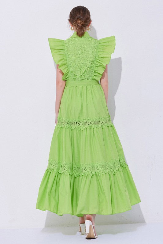 A green, midi-length piece with a tiered, ruffled silhouette and short puff sleeves, featuring delicate lace detailing for a romantic, bohemian look.