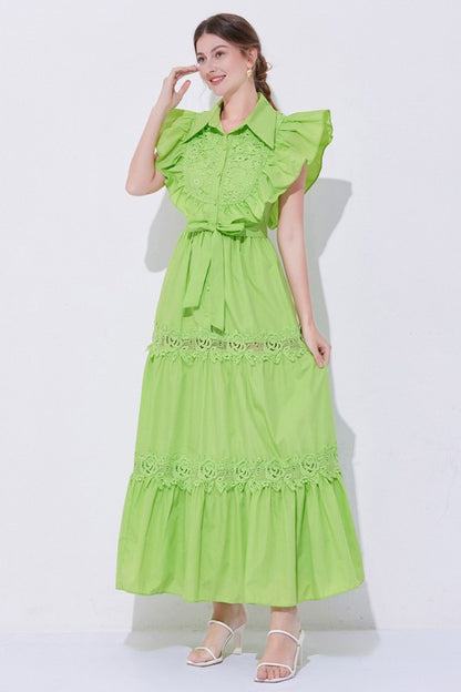 A green, midi-length piece with a tiered, ruffled silhouette and short puff sleeves, featuring delicate lace detailing for a romantic, bohemian look.