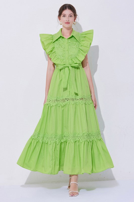 A green, midi-length piece with a tiered, ruffled silhouette and short puff sleeves, featuring delicate lace detailing for a romantic, bohemian look.