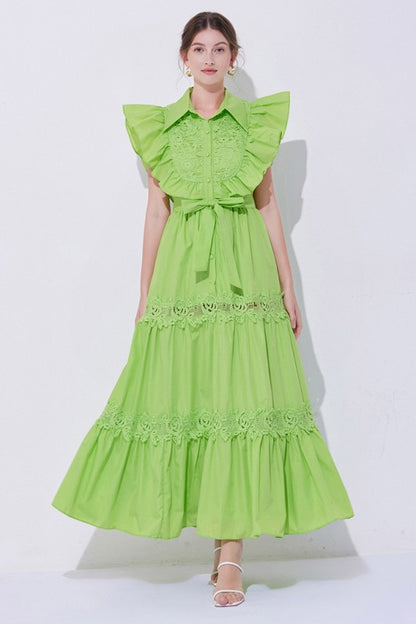 A green, midi-length piece with a tiered, ruffled silhouette and short puff sleeves, featuring delicate lace detailing for a romantic, bohemian look.