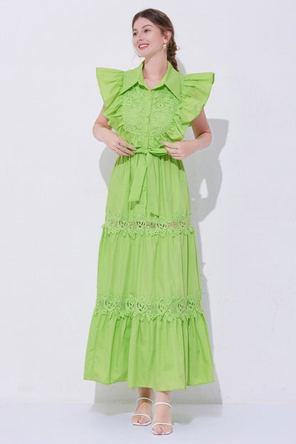 A green, midi-length piece with a tiered, ruffled silhouette and short puff sleeves, featuring delicate lace detailing for a romantic, bohemian look.