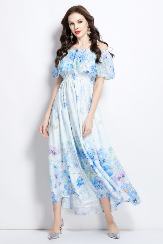 A light blue floral maxi dress with off-shoulder sleeves and a flowing, airy skirt.