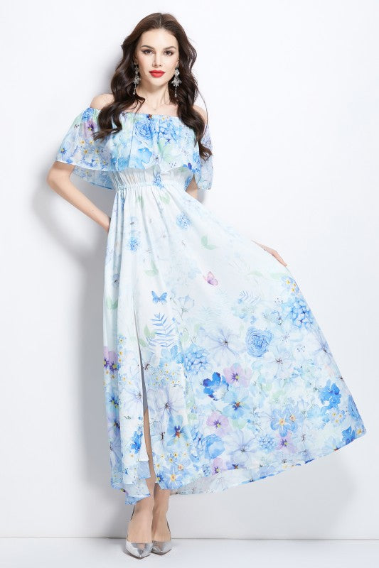 A light blue floral maxi dress with off-shoulder sleeves and a flowing, airy skirt.