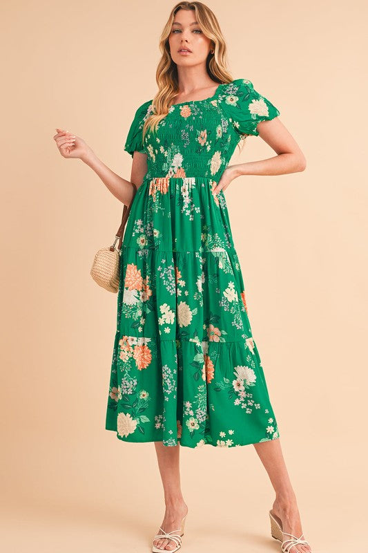 Casual spring or vacation dress, midi length, featuring a flattering smocked top and all-over flower pattern.