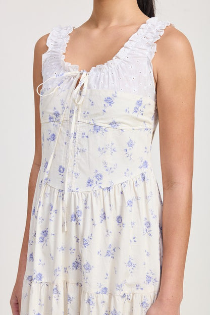 Women's floral print midi dress with lace trim, tiered skirt, and tie-front detail.