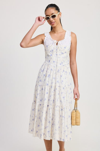 Women's floral print midi dress with lace trim, tiered skirt, and tie-front detail.