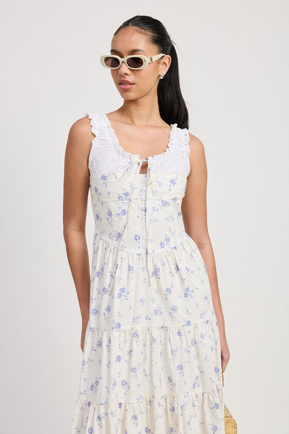 Women's floral print midi dress with lace trim, tiered skirt, and tie-front detail.