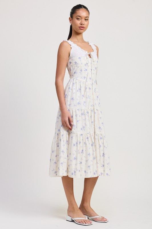 Women's floral print midi dress with lace trim, tiered skirt, and tie-front detail.