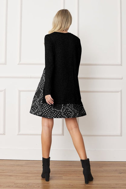 Women's long sleeve tunic top with bandana print layered hem and soft knit fabric.