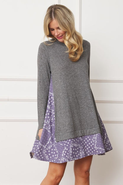 Women's long sleeve tunic top with bandana print layered hem and soft knit fabric.
