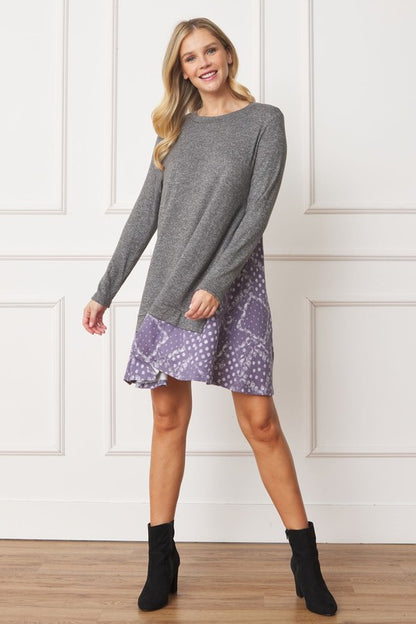 Women's long sleeve tunic top with bandana print layered hem and soft knit fabric.