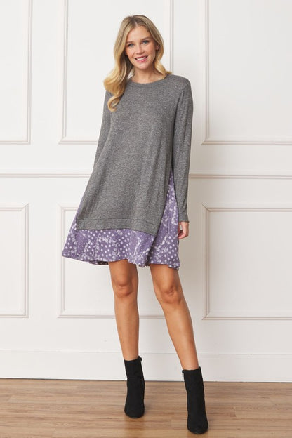 Women's long sleeve tunic top with bandana print layered hem and soft knit fabric.
